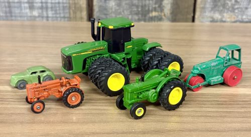 Five Toy Vehicles Including Ertl John Deere Tractors and a Matchbox Lesney Road Roller