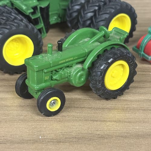 Five Toy Vehicles Including Ertl John Deere Tractors and a Matchbox Lesney Road Roller