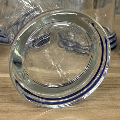 A Set of Six Fiesta Clear Glass Tumblers with Cobalt Blue Ringed Bases