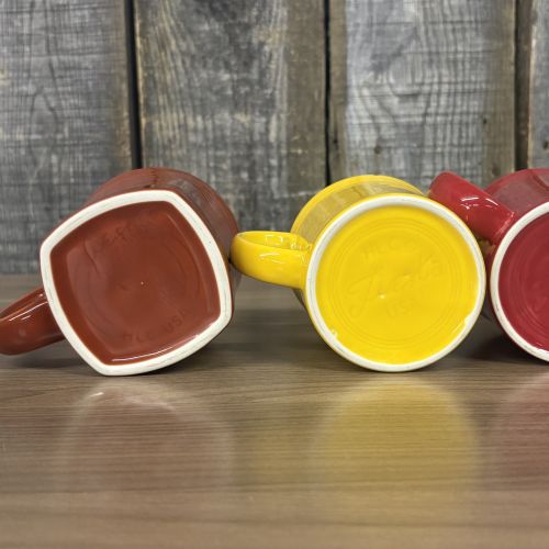 A Set of Homer Laughlin Fiesta Ceramic Mugs in Various Colors