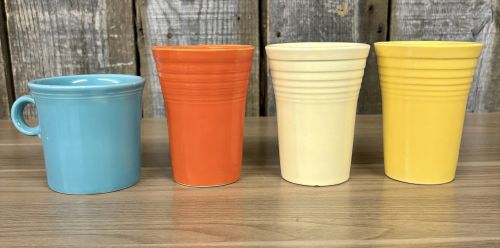 A Collection of Homer Laughlin Fiestaware including a Ring Handle Mug and Water Tumblers