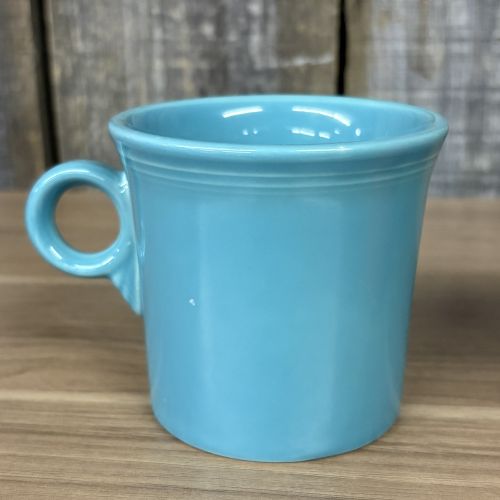 A Collection of Homer Laughlin Fiestaware including a Ring Handle Mug and Water Tumblers