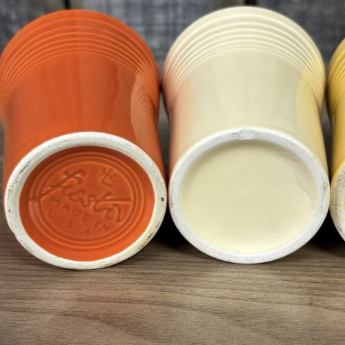 A Collection of Homer Laughlin Fiestaware including a Ring Handle Mug and Water Tumblers
