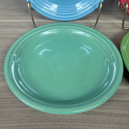 A Set of Four Homer Laughlin Fiesta Glazed Earthenware Bread and Butter Plates