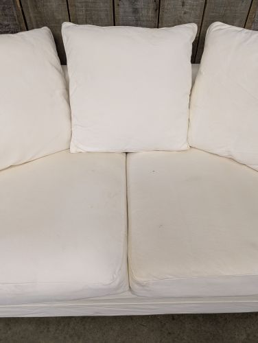 Contemporary Slipcovered Two Seat Sofa with Rolled Arms