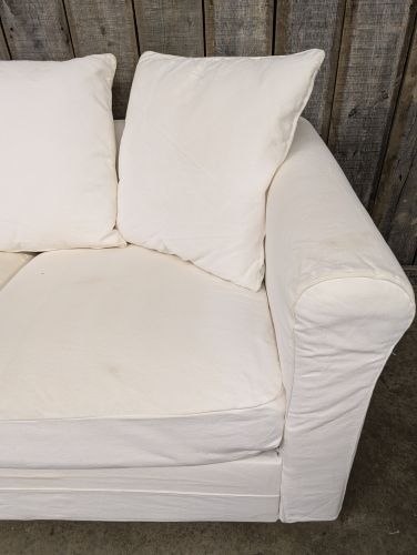 Contemporary Slipcovered Two Seat Sofa with Rolled Arms