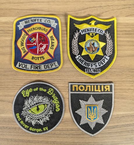 A Lot of Four Assorted Contemporary Embroidered Emergency Service and Commemorative Patches