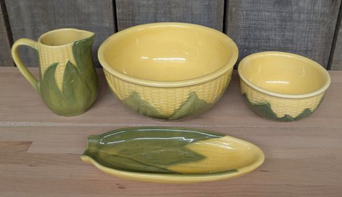 A Set of Four Shawnee Pottery Corn King Pattern Kitchenware Pieces