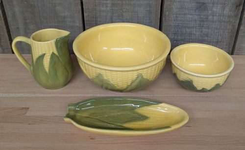A Set of Four Shawnee Pottery Corn King Pattern Kitchenware Pieces