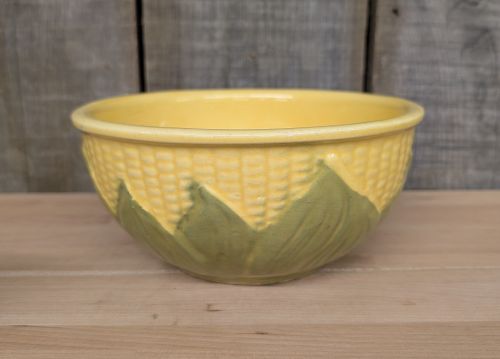 A Set of Four Shawnee Pottery Corn King Pattern Kitchenware Pieces