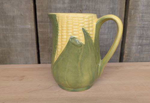 A Set of Four Shawnee Pottery Corn King Pattern Kitchenware Pieces