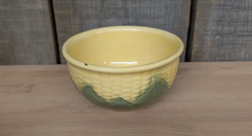 A Set of Four Shawnee Pottery Corn King Pattern Kitchenware Pieces
