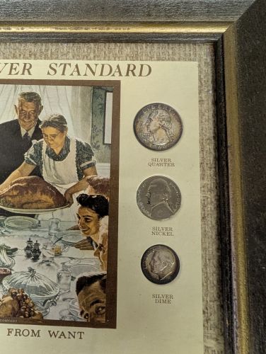 A 1974 Kennedy Mint The Silver Standard Framed Collection of US Coins and Currency