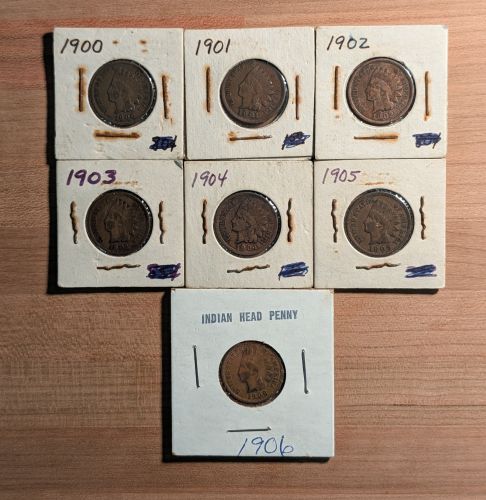 A Collection of Seven US Indian Head Pennies, 1900-1906