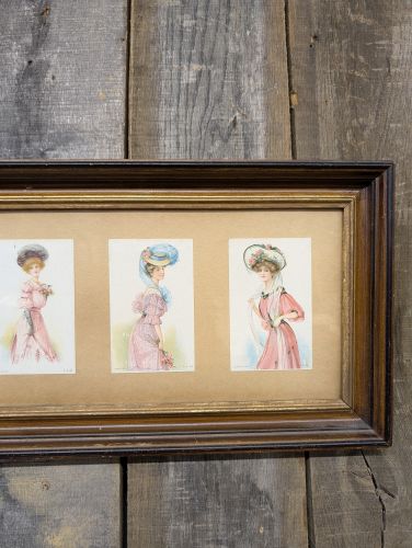 A Collection of Four Edwardian Fashion Prints in a Wood Frame