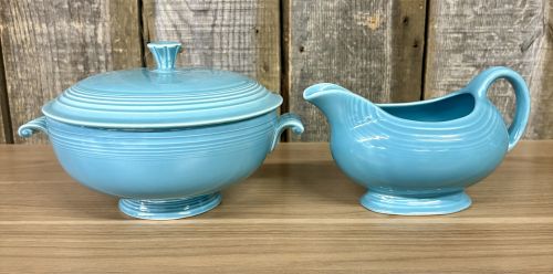 A Pair of Vintage Turquoise Fiestaware Serving Pieces including Lidded Casserole and Gravy Boat