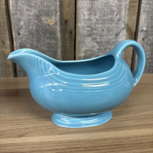 A Pair of Vintage Turquoise Fiestaware Serving Pieces including Lidded Casserole and Gravy Boat