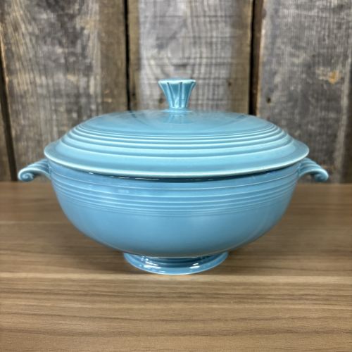 A Pair of Vintage Turquoise Fiestaware Serving Pieces including Lidded Casserole and Gravy Boat