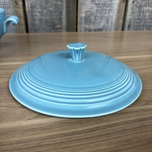 A Pair of Vintage Turquoise Fiestaware Serving Pieces including Lidded Casserole and Gravy Boat