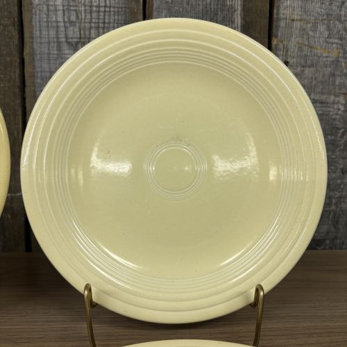 A Set of Four Homer Laughlin Fiesta Yellow Dinner Plates