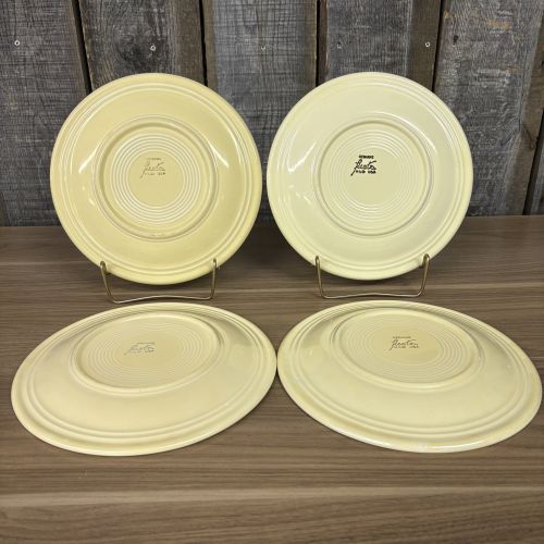 A Set of Four Homer Laughlin Fiesta Yellow Dinner Plates
