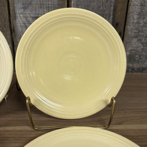 A Set of Four Homer Laughlin Fiesta Yellow Bread and Butter Plates