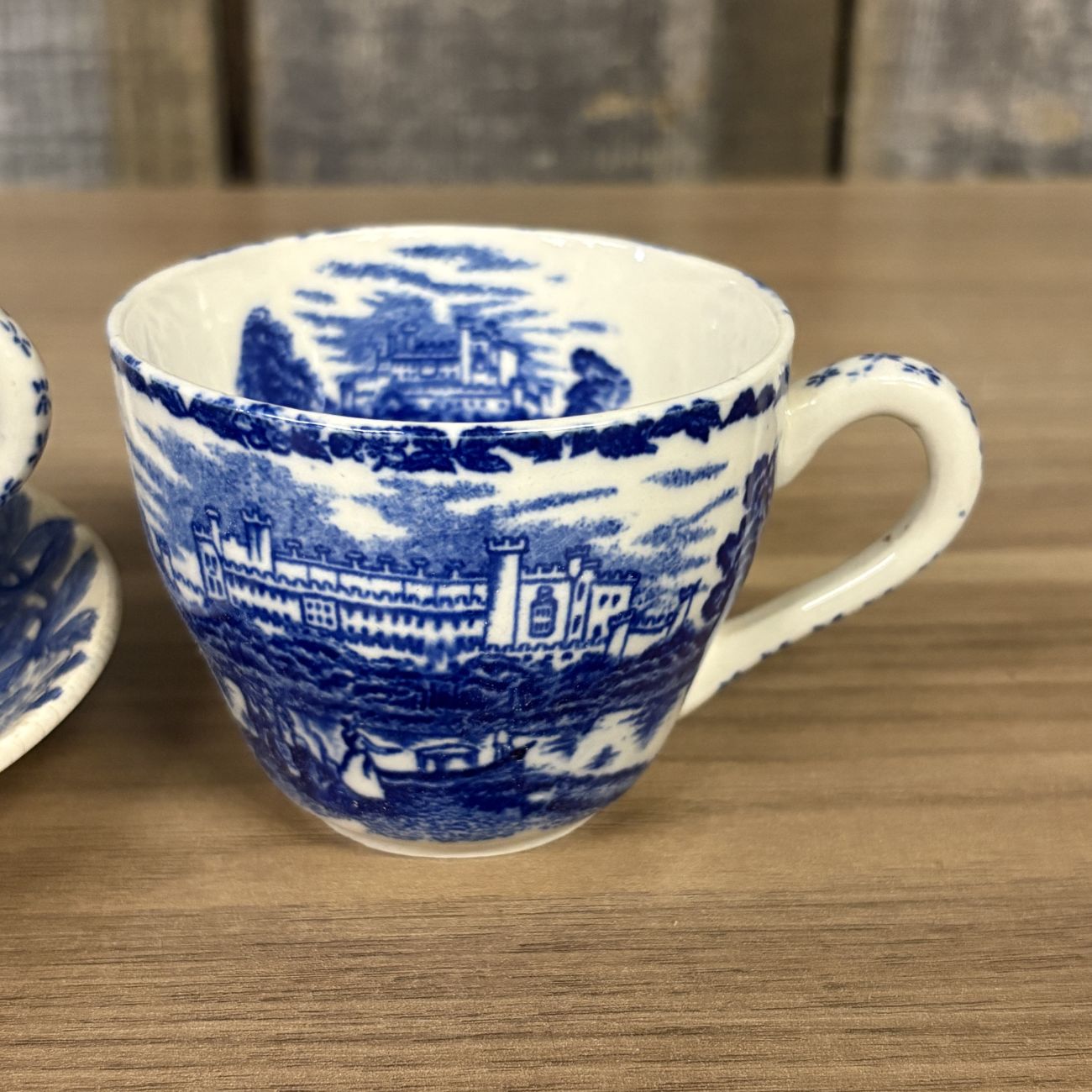 Four Blue and White Transfer-Printed Earthenware Teacups and One Saucer Featuring Windsor Castle
