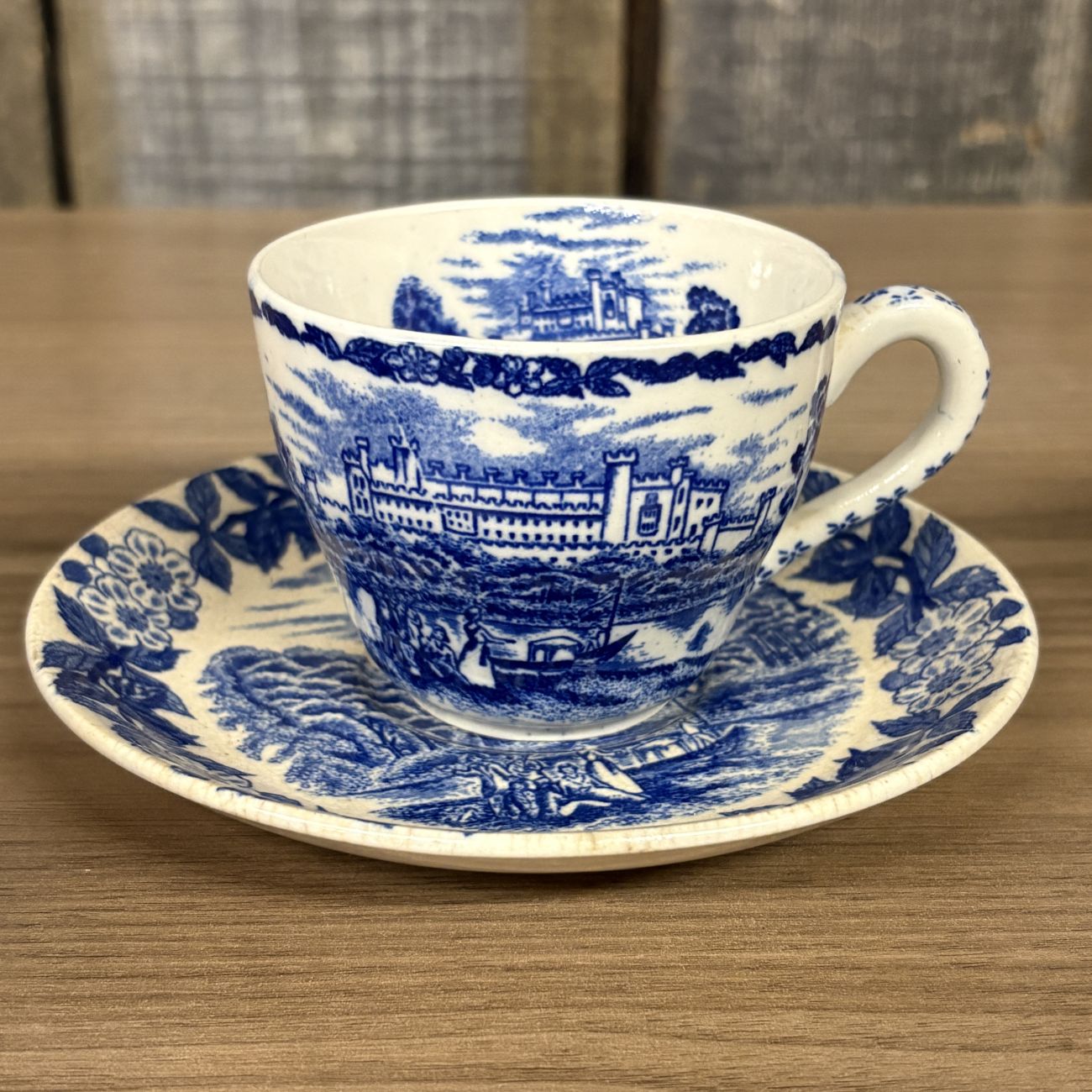 Four Blue and White Transfer-Printed Earthenware Teacups and One Saucer Featuring Windsor Castle