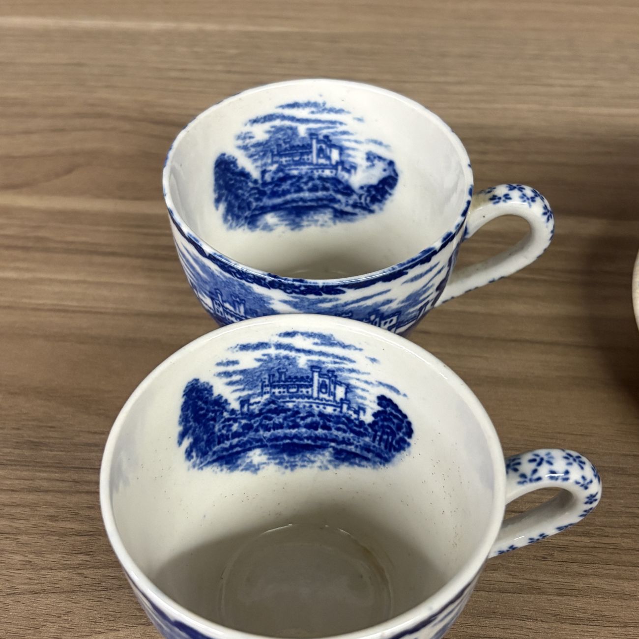 Four Blue and White Transfer-Printed Earthenware Teacups and One Saucer Featuring Windsor Castle