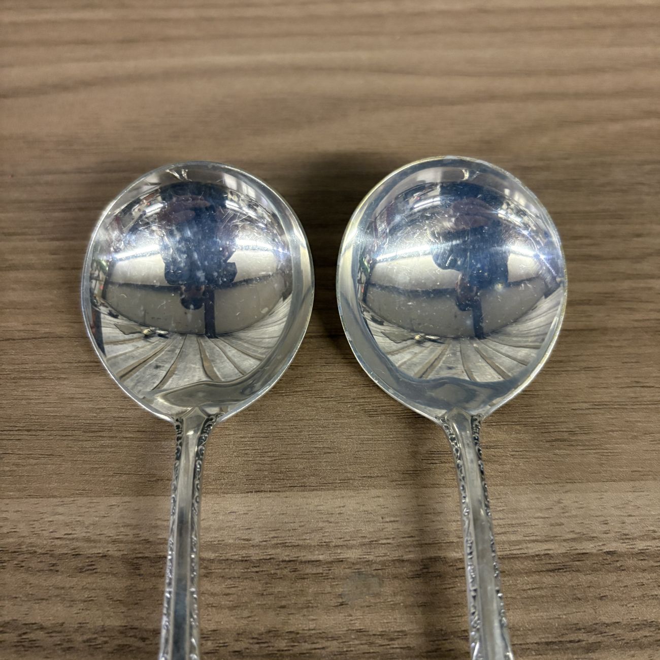 A Pair of Towle Sterling Silver Cream Soup Spoons in the Candlelight Pattern