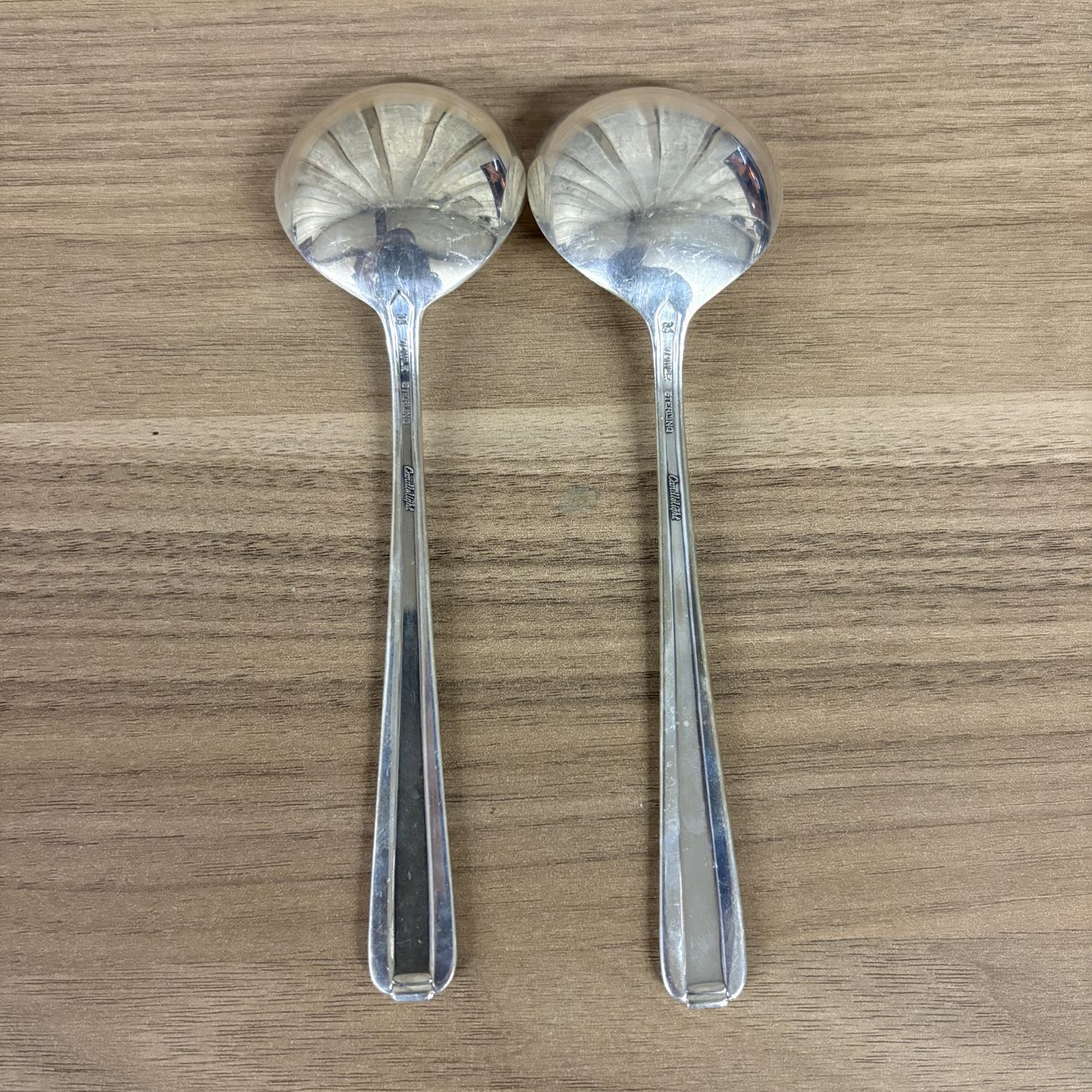 A Pair of Towle Sterling Silver Cream Soup Spoons in the Candlelight Pattern