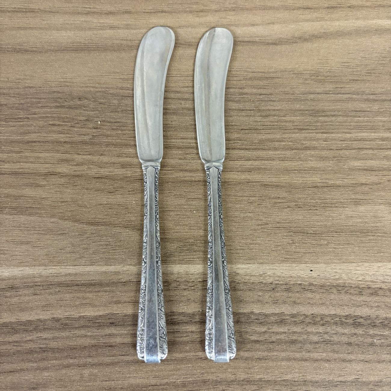 A Pair of Towle Sterling Silver Flat Handle Butter Spreaders in the Candlelight Pattern