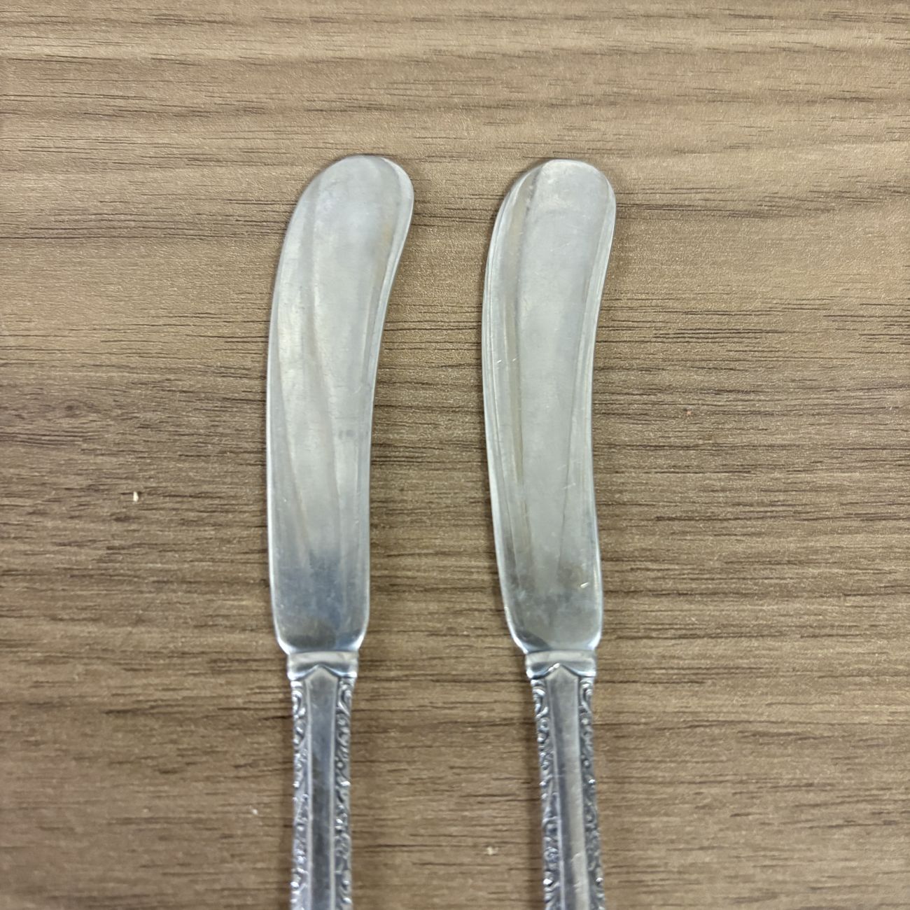 A Pair of Towle Sterling Silver Flat Handle Butter Spreaders in the Candlelight Pattern