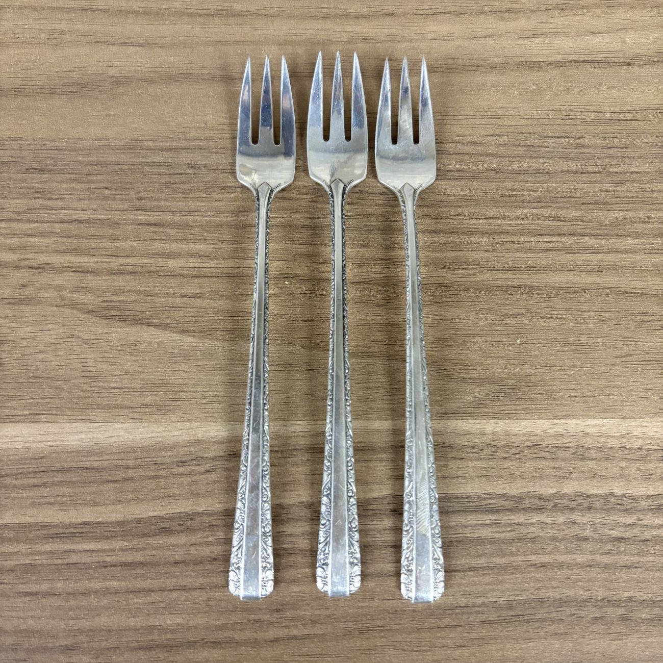 A Trio of Towle Sterling Silver Cocktail Forks in the Candlelight Pattern