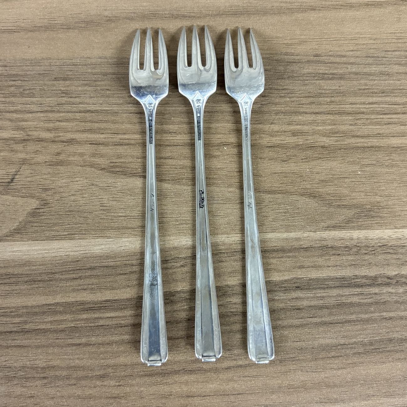 A Trio of Towle Sterling Silver Cocktail Forks in the Candlelight Pattern