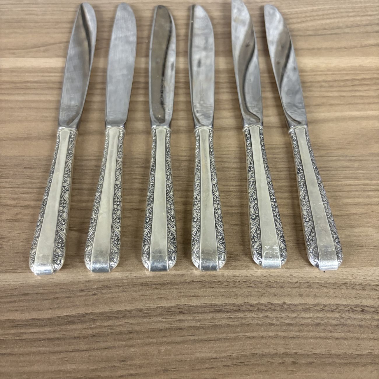 A Set of Six Towle Sterling Silver Handled Dinner Knives in the Rambler Rose Pattern