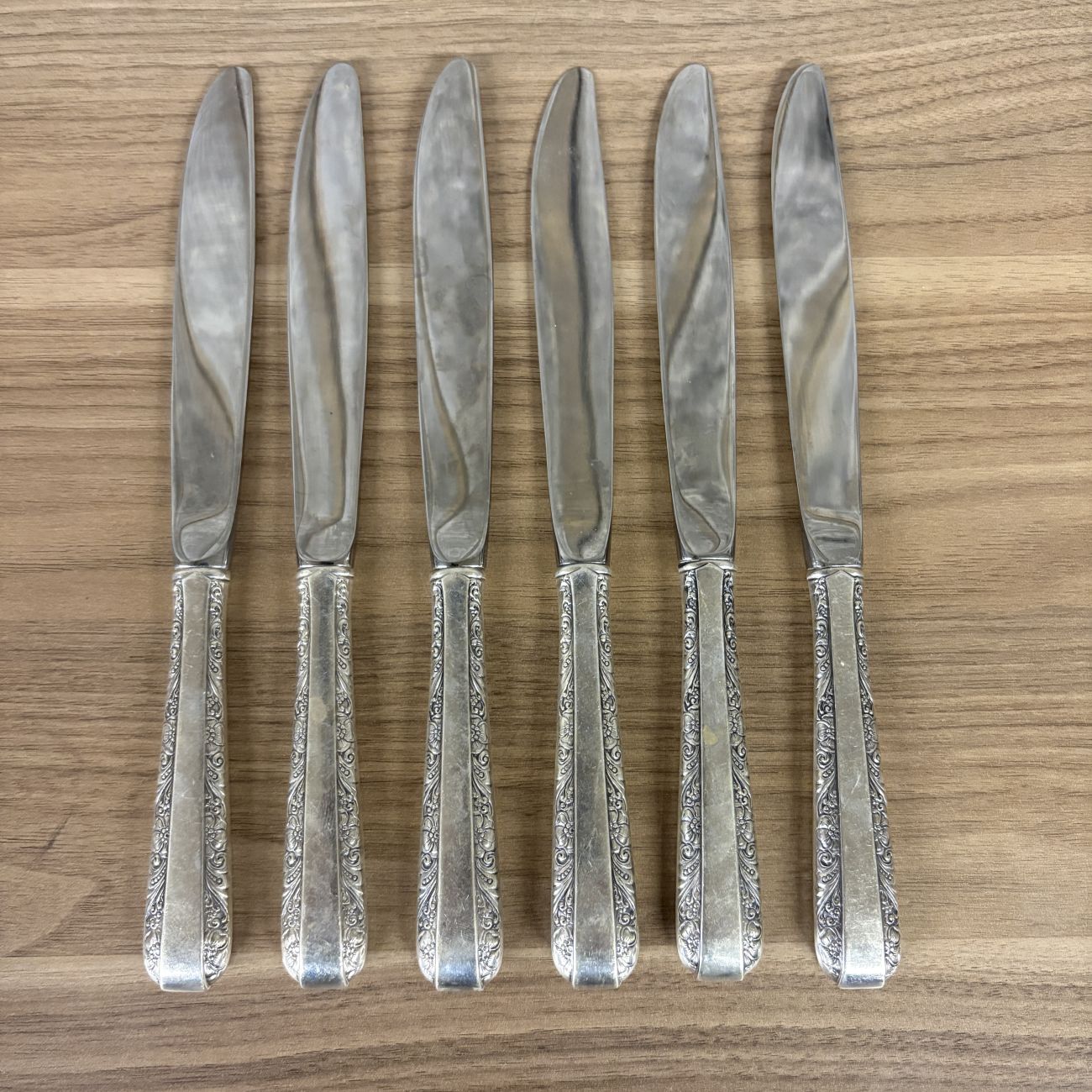 A Set of Six Towle Sterling Silver Handled Dinner Knives in the Rambler Rose Pattern