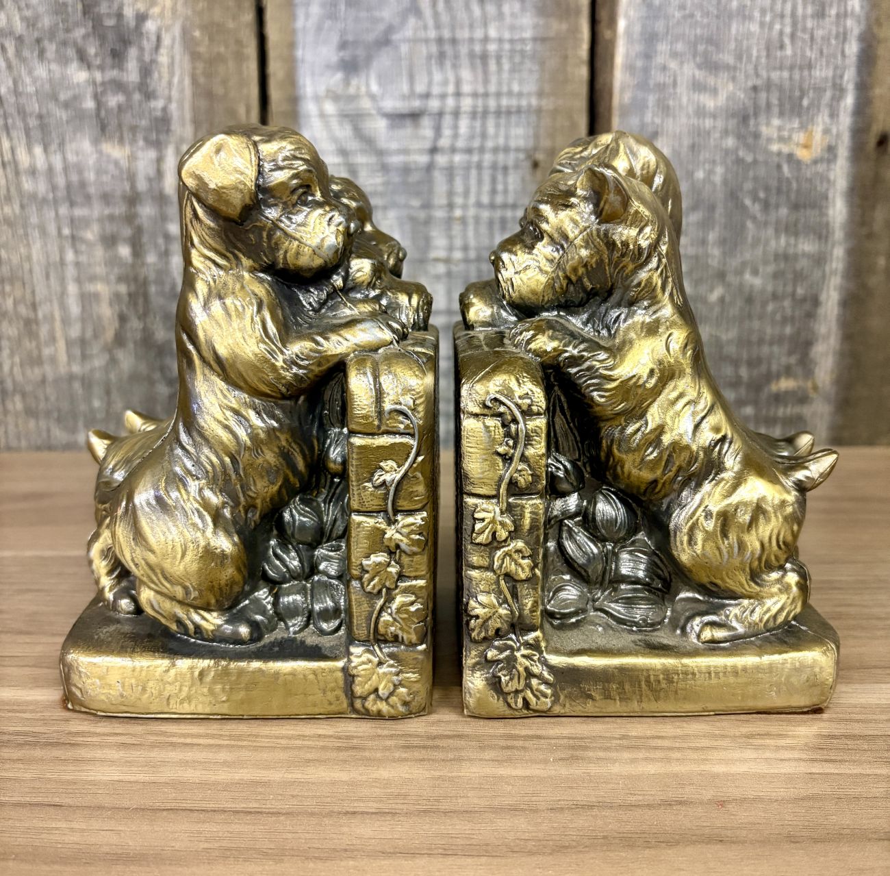 A Pair of Vintage Cast Metal Terrier and Puppy Bookends with Gold Toned Finish