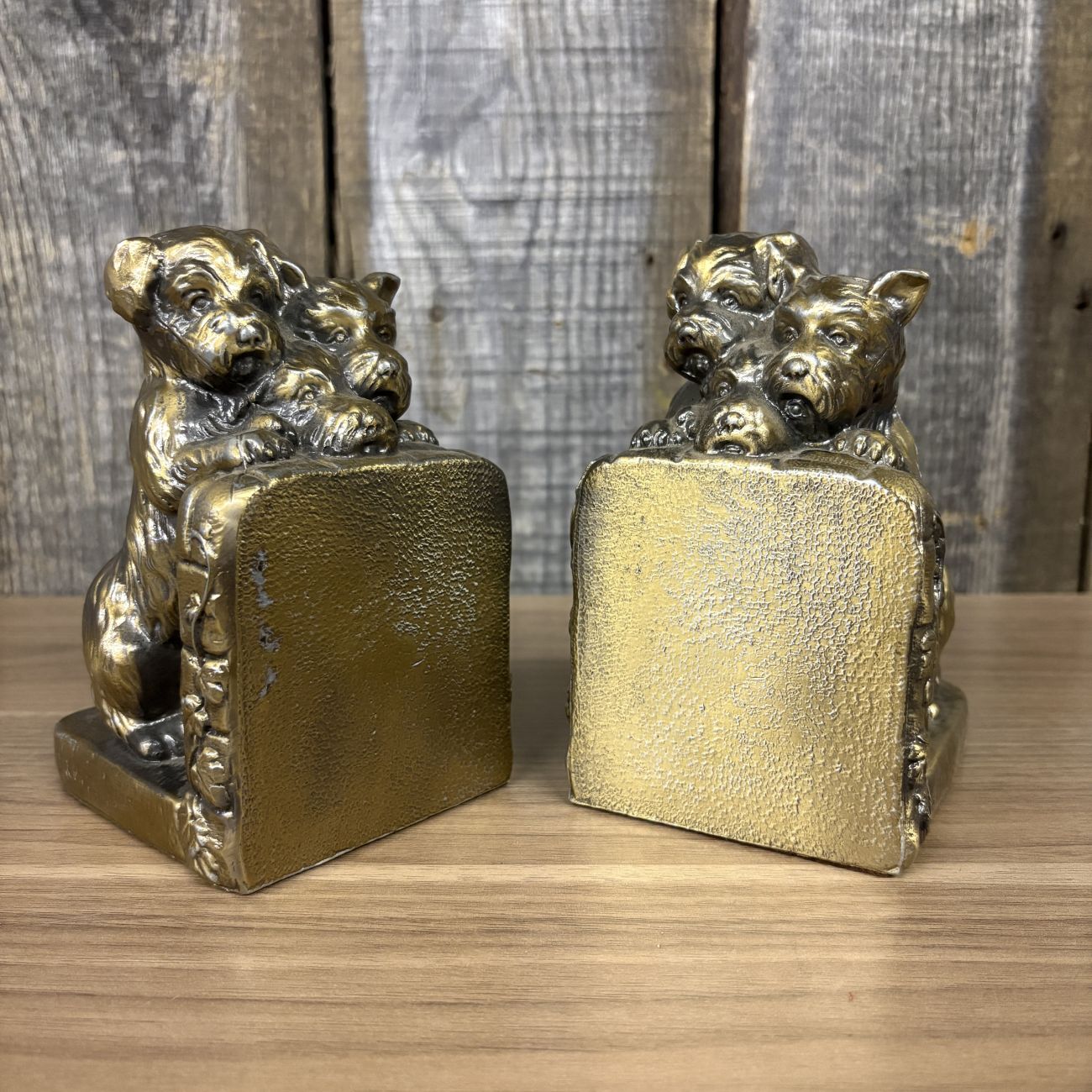 A Pair of Vintage Cast Metal Terrier and Puppy Bookends with Gold Toned Finish