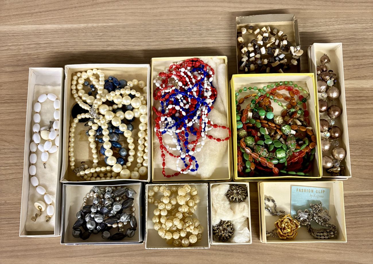 An Assortment of Vintage Costume Jewelry Including Fashion Clip by Regina and Venetian Style Glass Beads