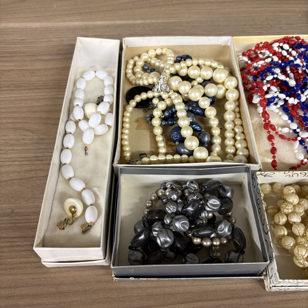An Assortment of Vintage Costume Jewelry Including Fashion Clip by Regina and Venetian Style Glass Beads