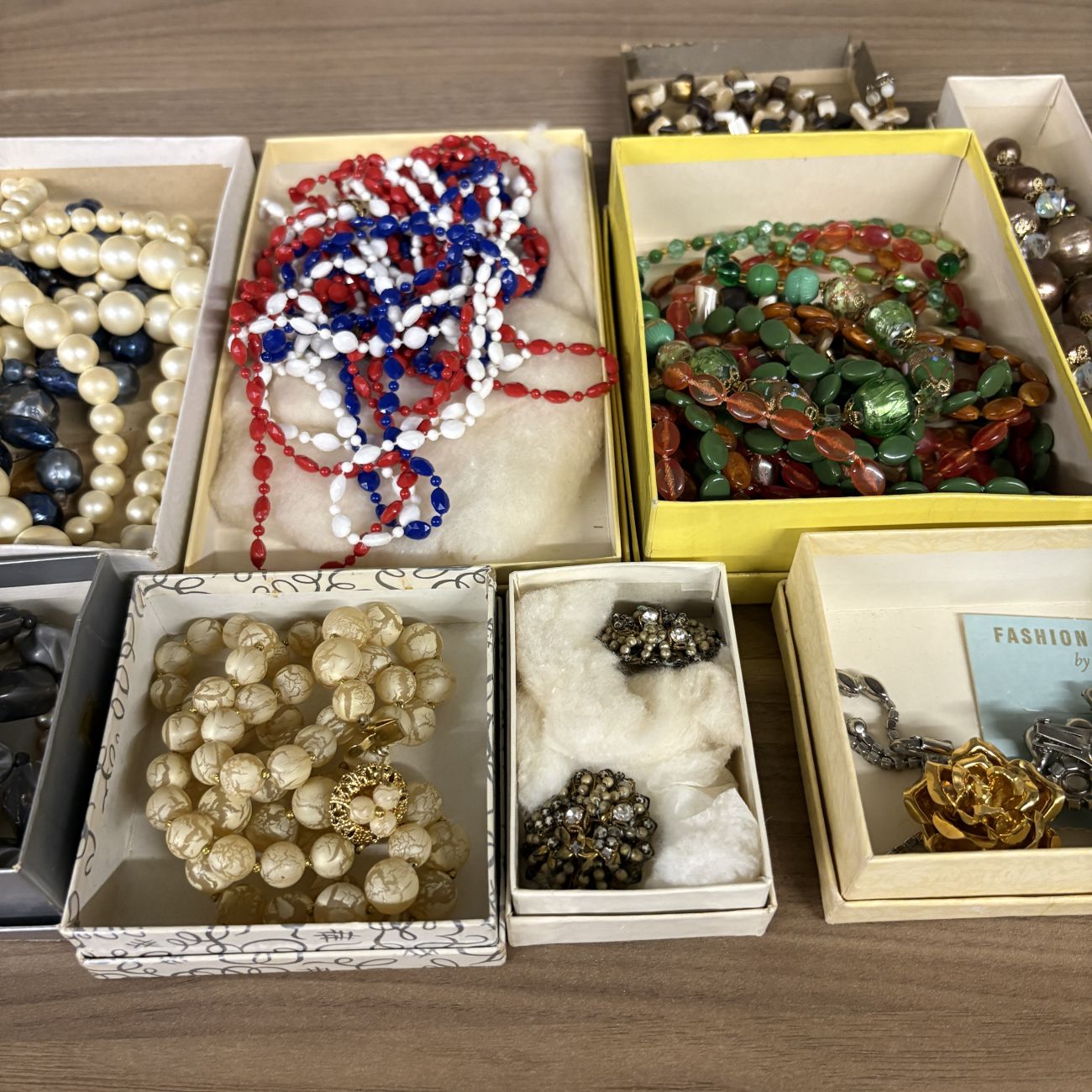 An Assortment of Vintage Costume Jewelry Including Fashion Clip by Regina and Venetian Style Glass Beads