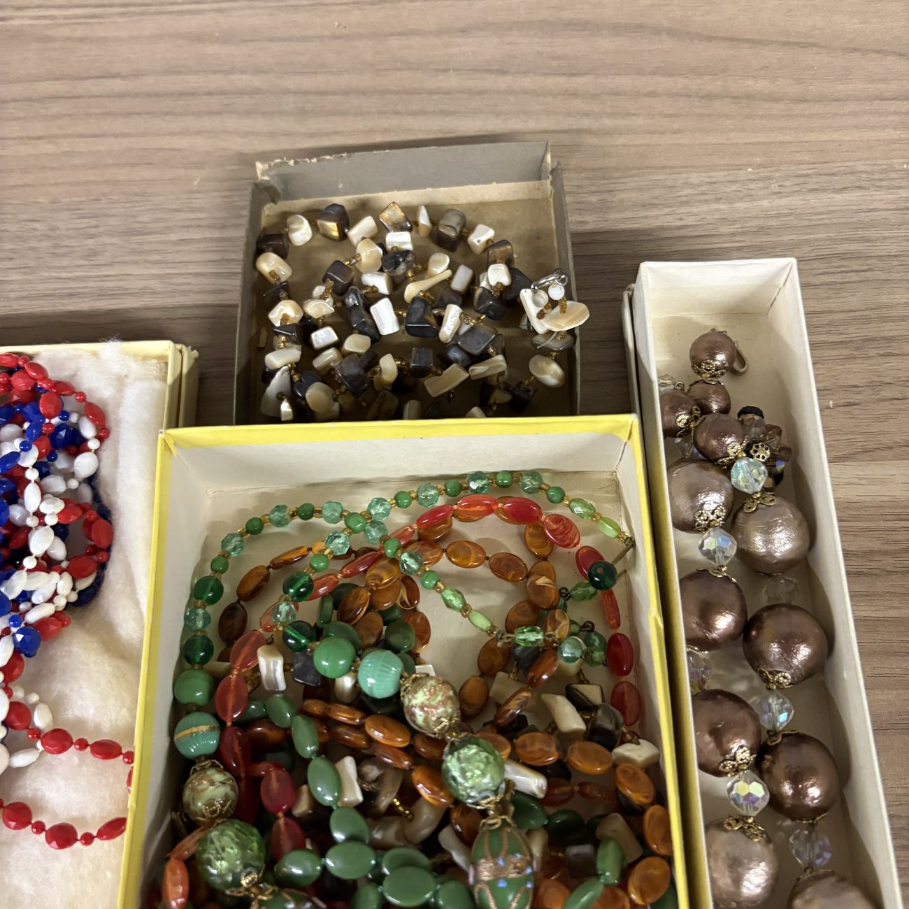 An Assortment of Vintage Costume Jewelry Including Fashion Clip by Regina and Venetian Style Glass Beads