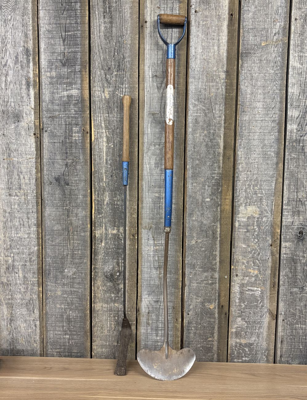 Two Antique Blue Grass Brand Agricultural Hand Tools