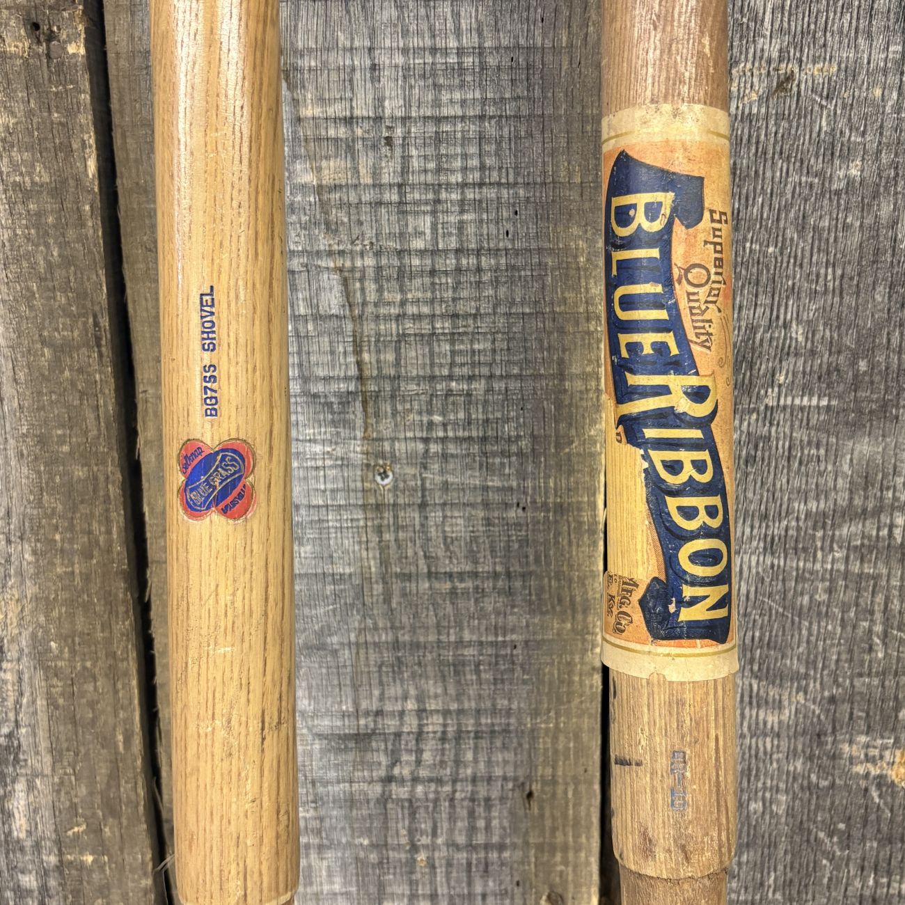 A Pair of Vintage Belknap Blue Grass and Shapleigh Blue Ribbon D-Handle Tool Shafts