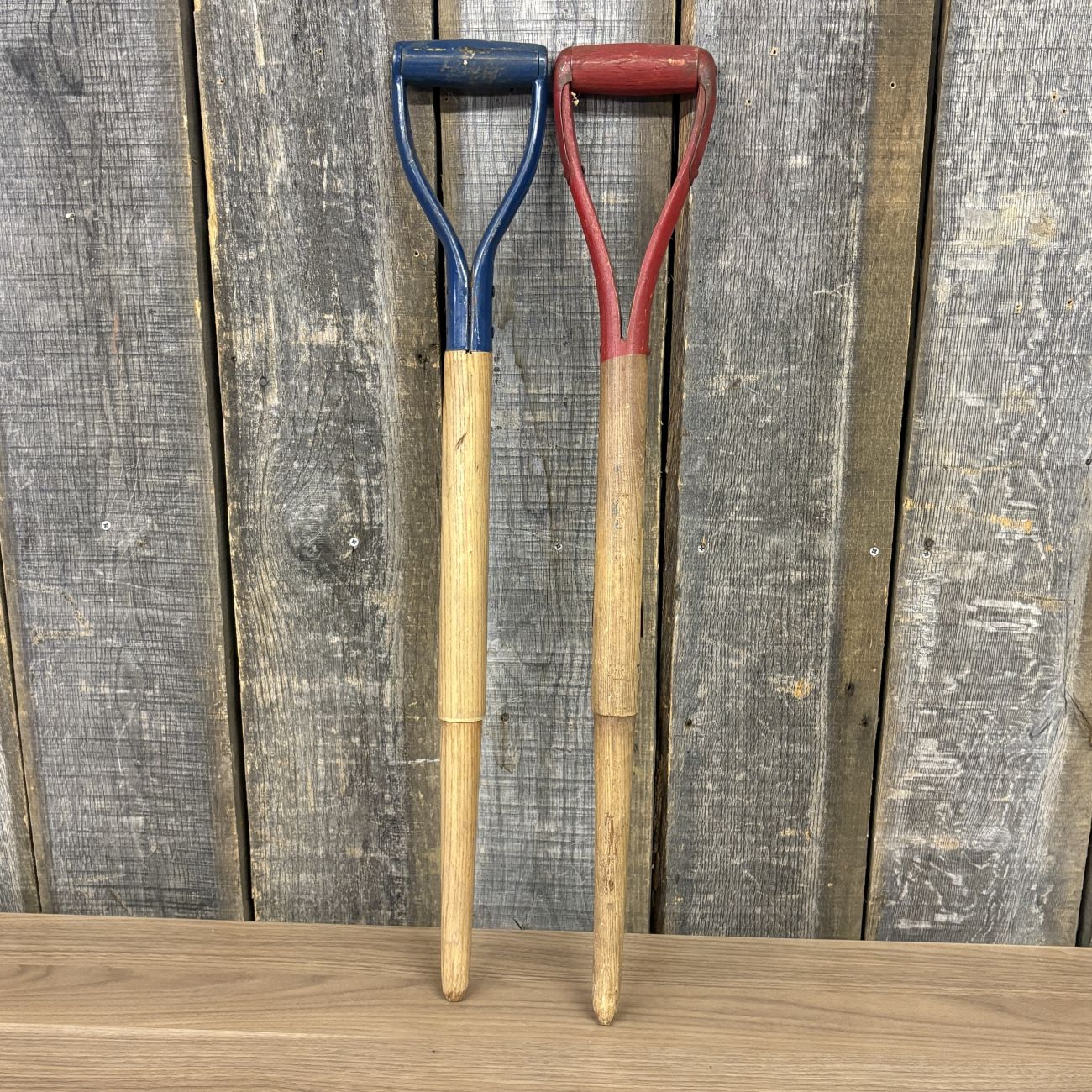 A Pair of Vintage Belknap Blue Grass and Shapleigh Blue Ribbon D-Handle Tool Shafts