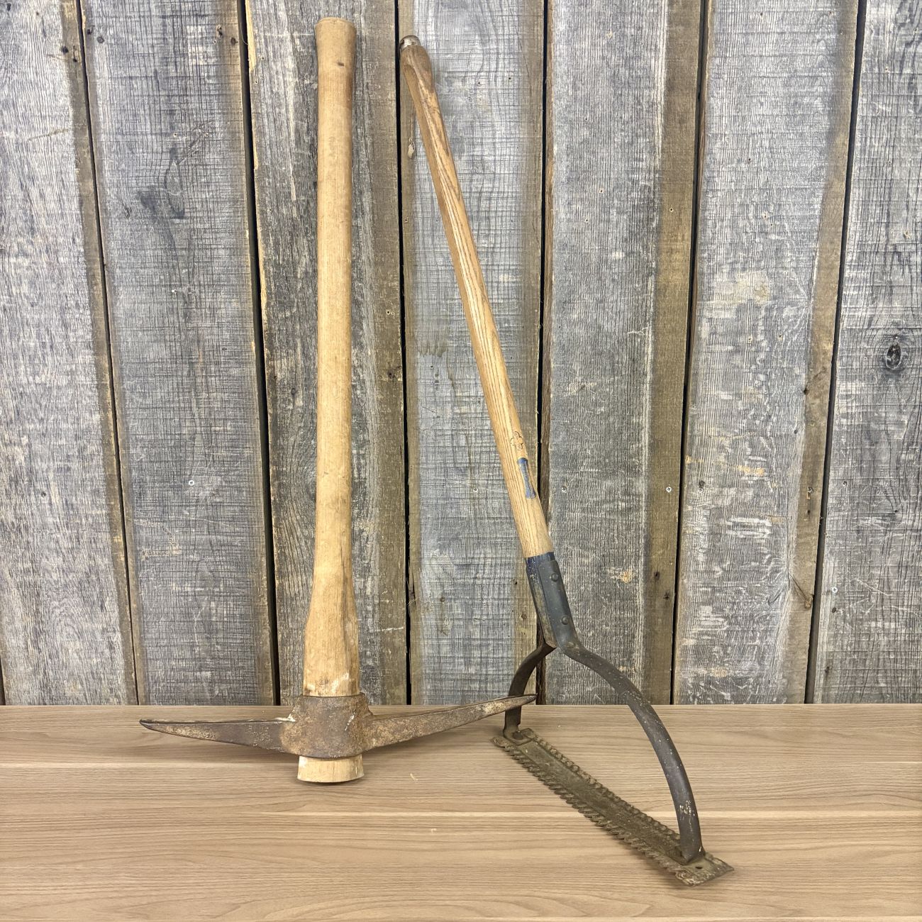 Two Vintage Blue Grass Belknap Hardware Agricultural Tools Including a Pickaxe and a Weed Cutter