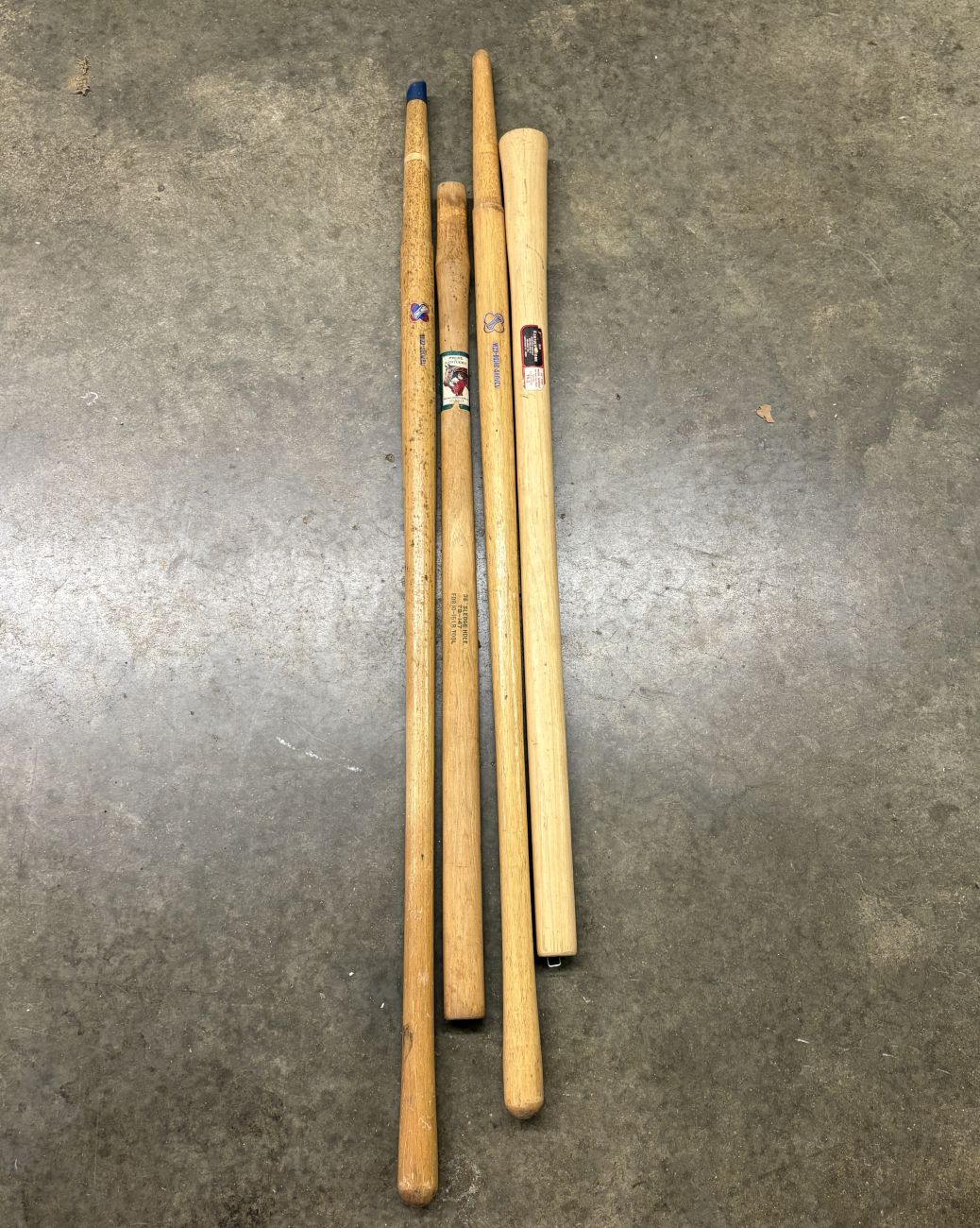 A Group of Four Vintage Belknap and Blue Grass Wooden Replacement Tool Handles