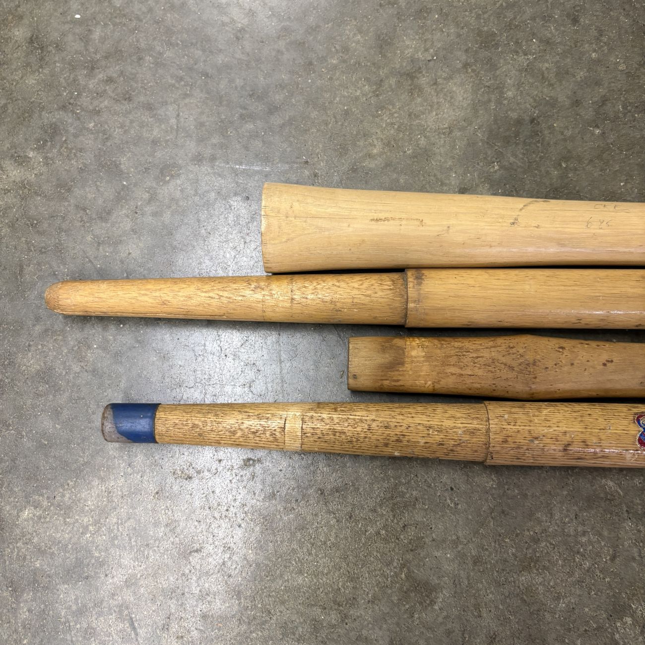 A Group of Four Vintage Belknap and Blue Grass Wooden Replacement Tool Handles