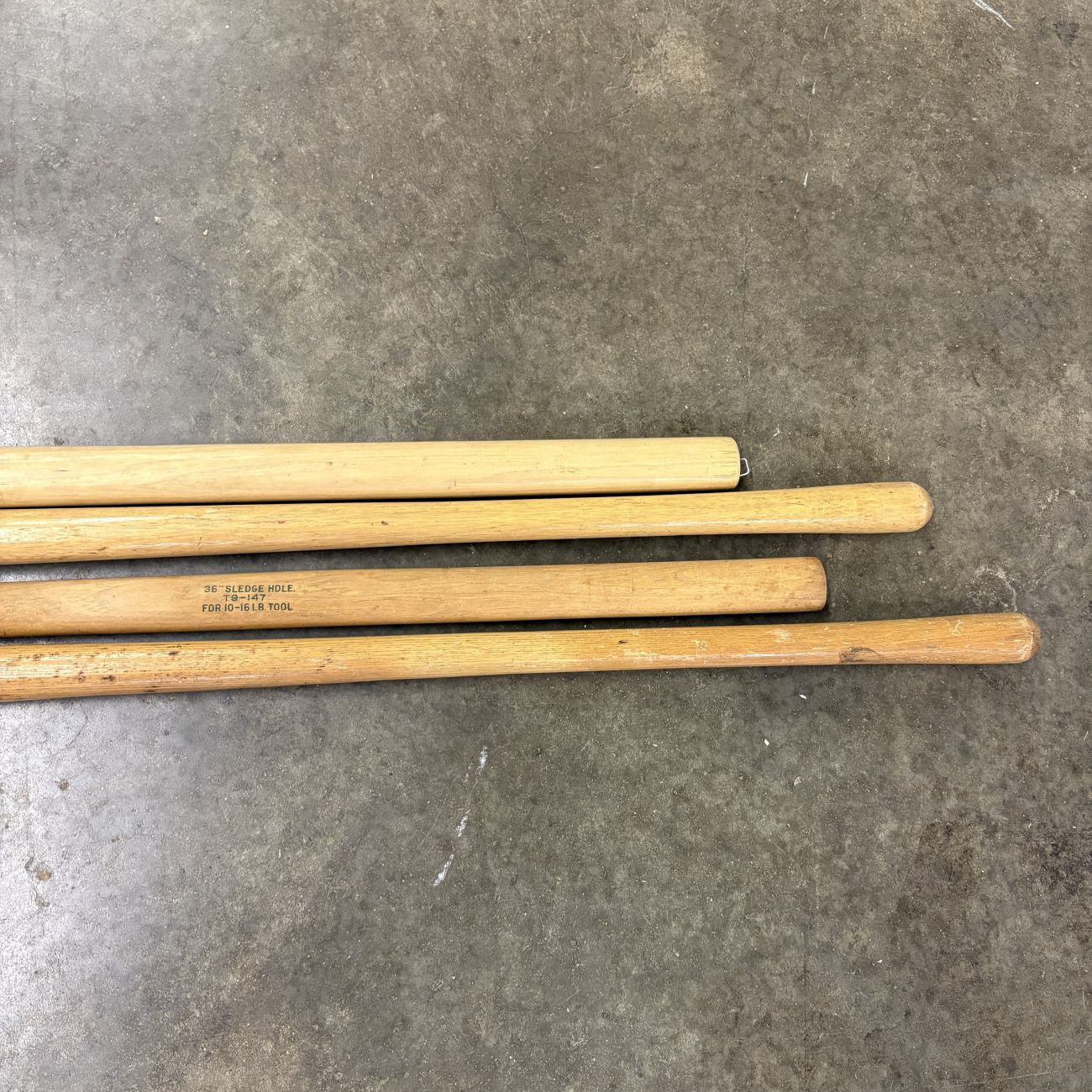 A Group of Four Vintage Belknap and Blue Grass Wooden Replacement Tool Handles